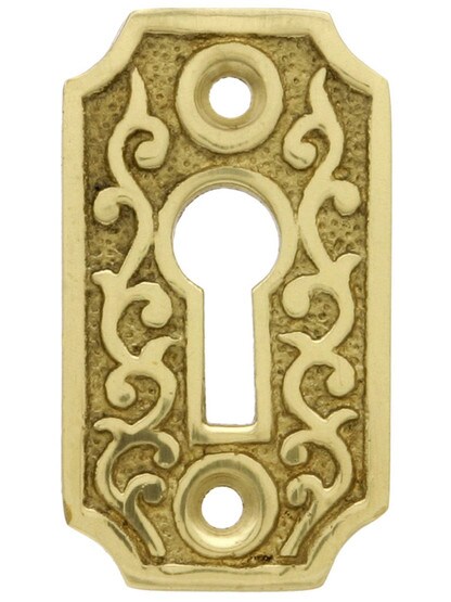 Solid Brass Scroll Keyhole Cover in Un-Lacquered Brass.